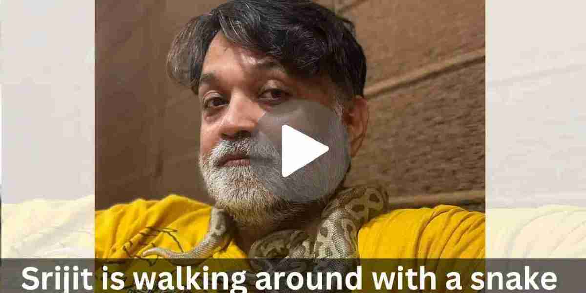 Srijit is walking around with a snake around his neck