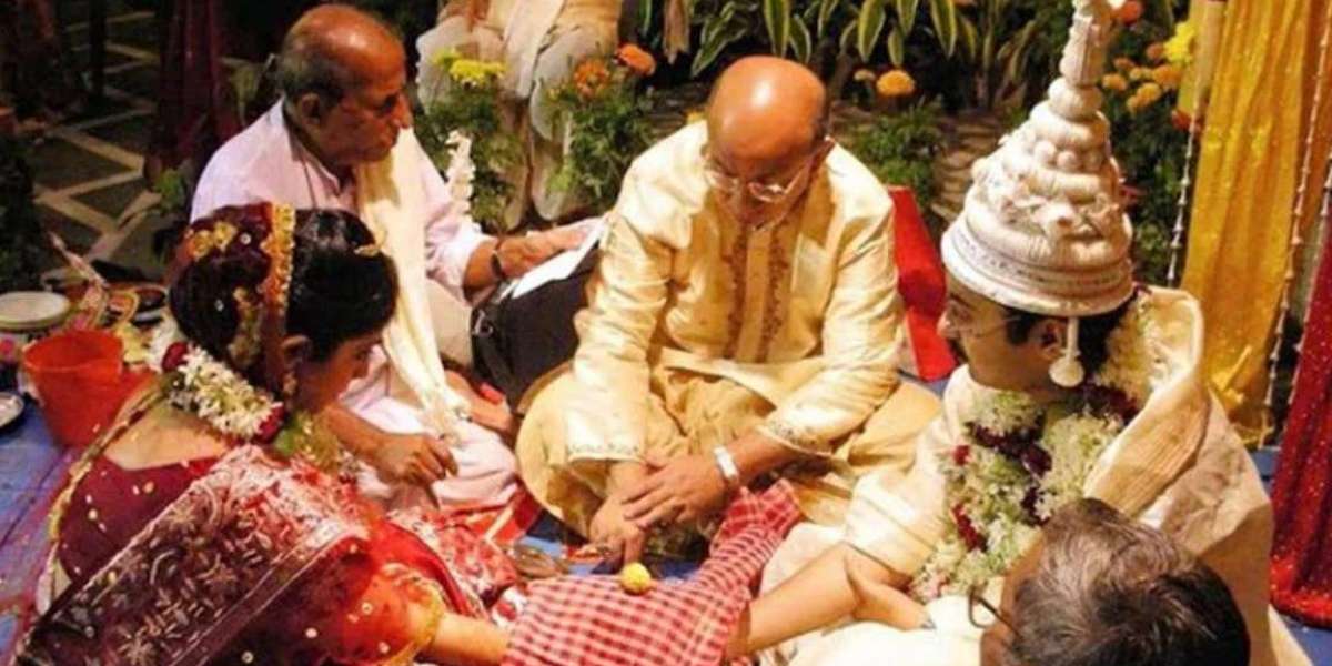 Why does the bride sit to the left of the groom during the wedding?