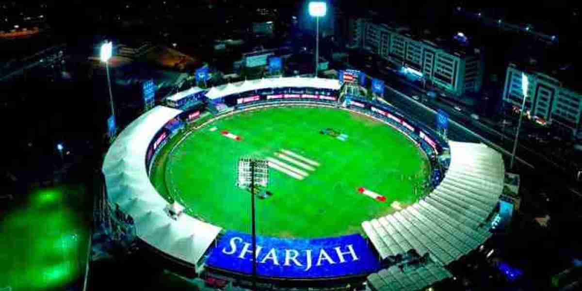 Sharjah Cricket Stadium standing in front of historical records