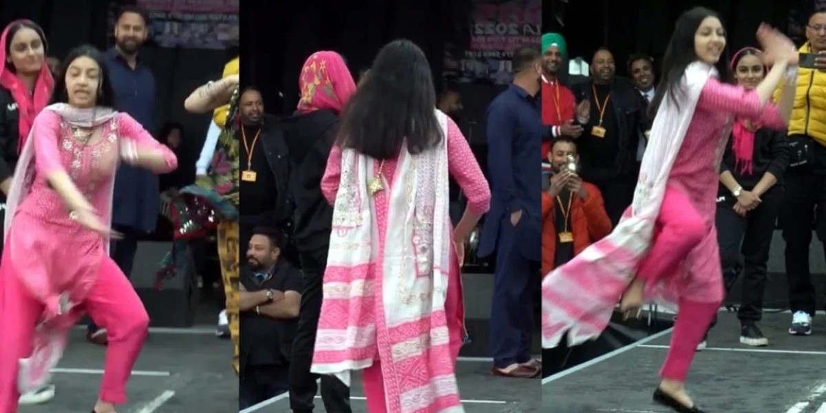 A beautiful young woman stormed the streets with a boisterous dance to Punjabi songs