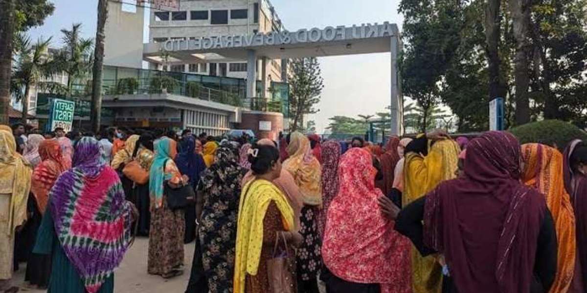 Workers protest by blocking the road in Dhamrai