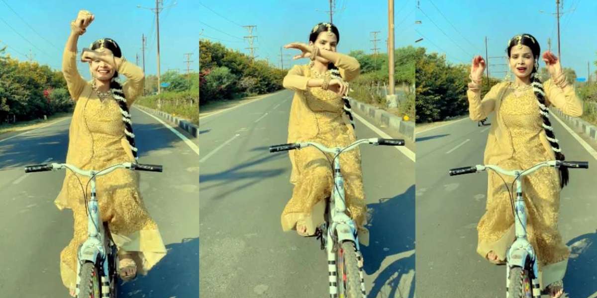 The young woman created a storm by dancing to the rhythm of the song and dancing on a bicycle