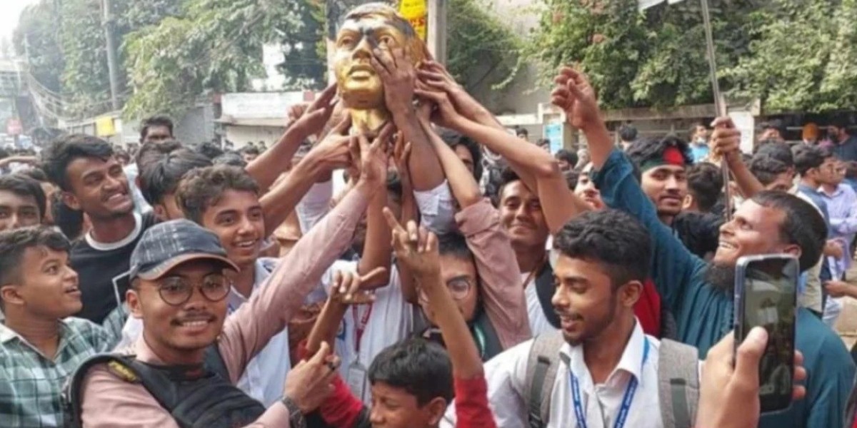 After the vandalism, the students cheered by breaking the sculpture